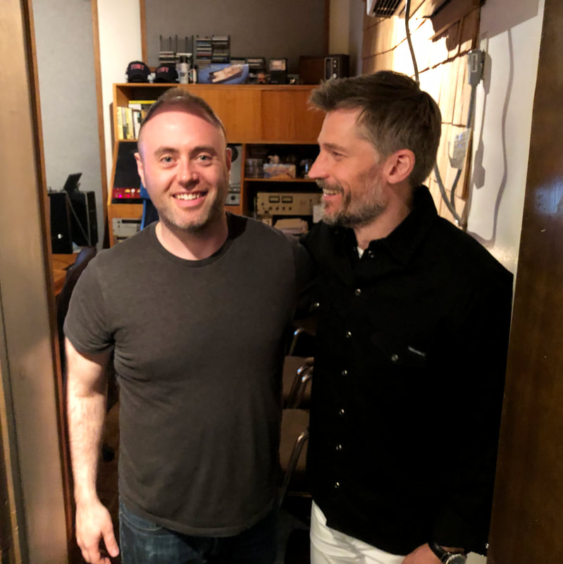 Jamie stands with Nikolaj Coster Waldao from Game of Thrones, recording an episode of In The Envelope podcast by Backstage